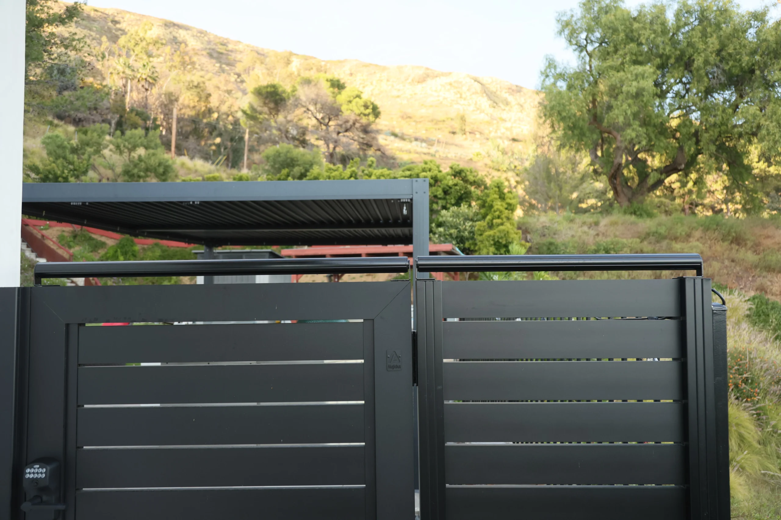 Landscape view of coyote roller across gate opening
