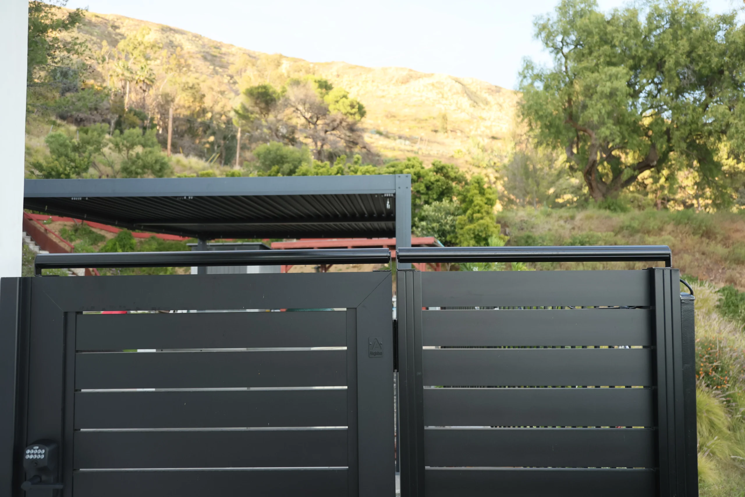 Wide gate-top coyote roller view with hillside background