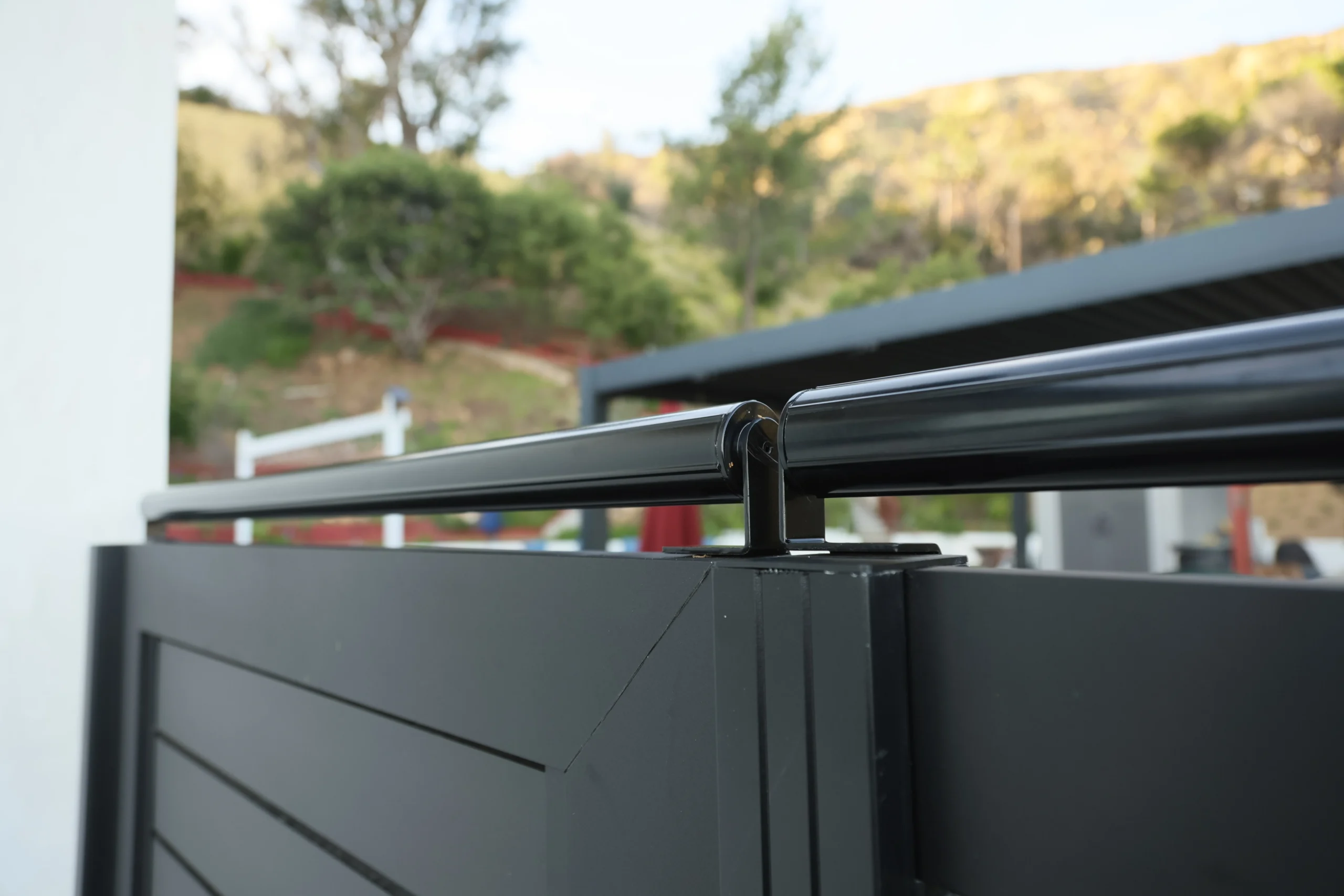 Close-up black coyote roller bracket detail