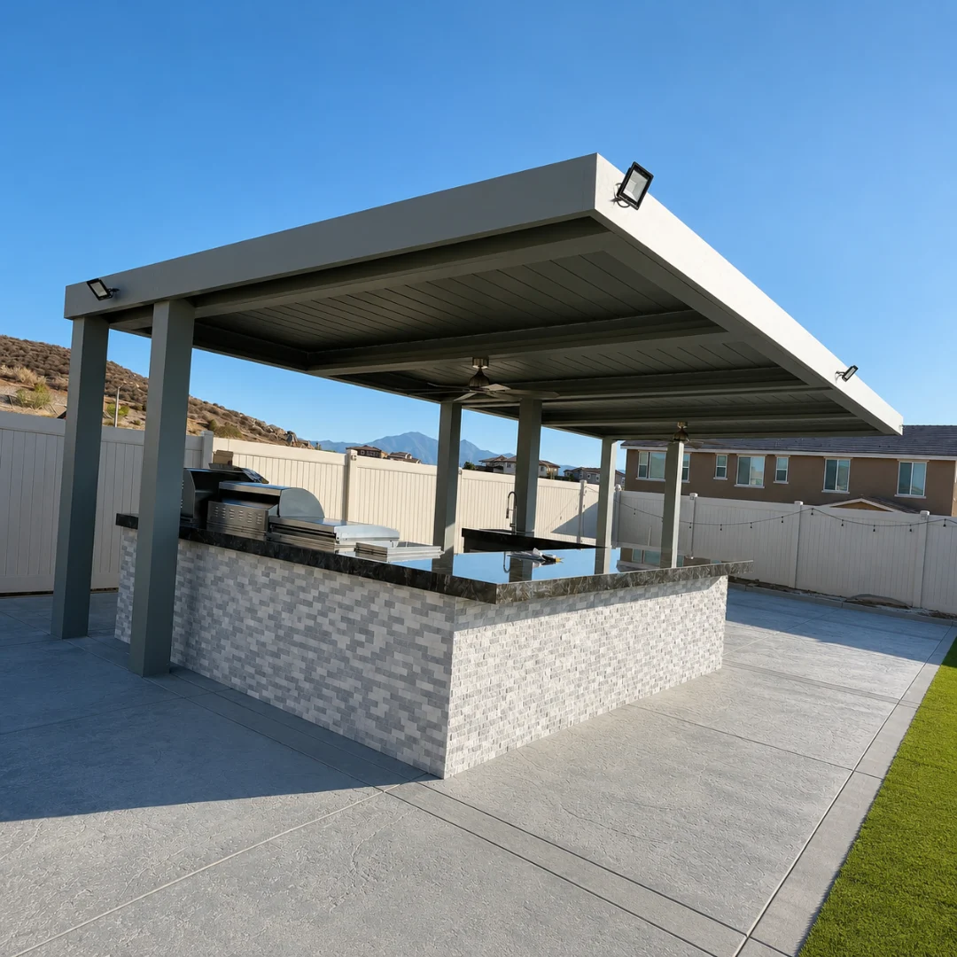 Gray automatic louver patio cover closed above a backyard outdoor kitchen