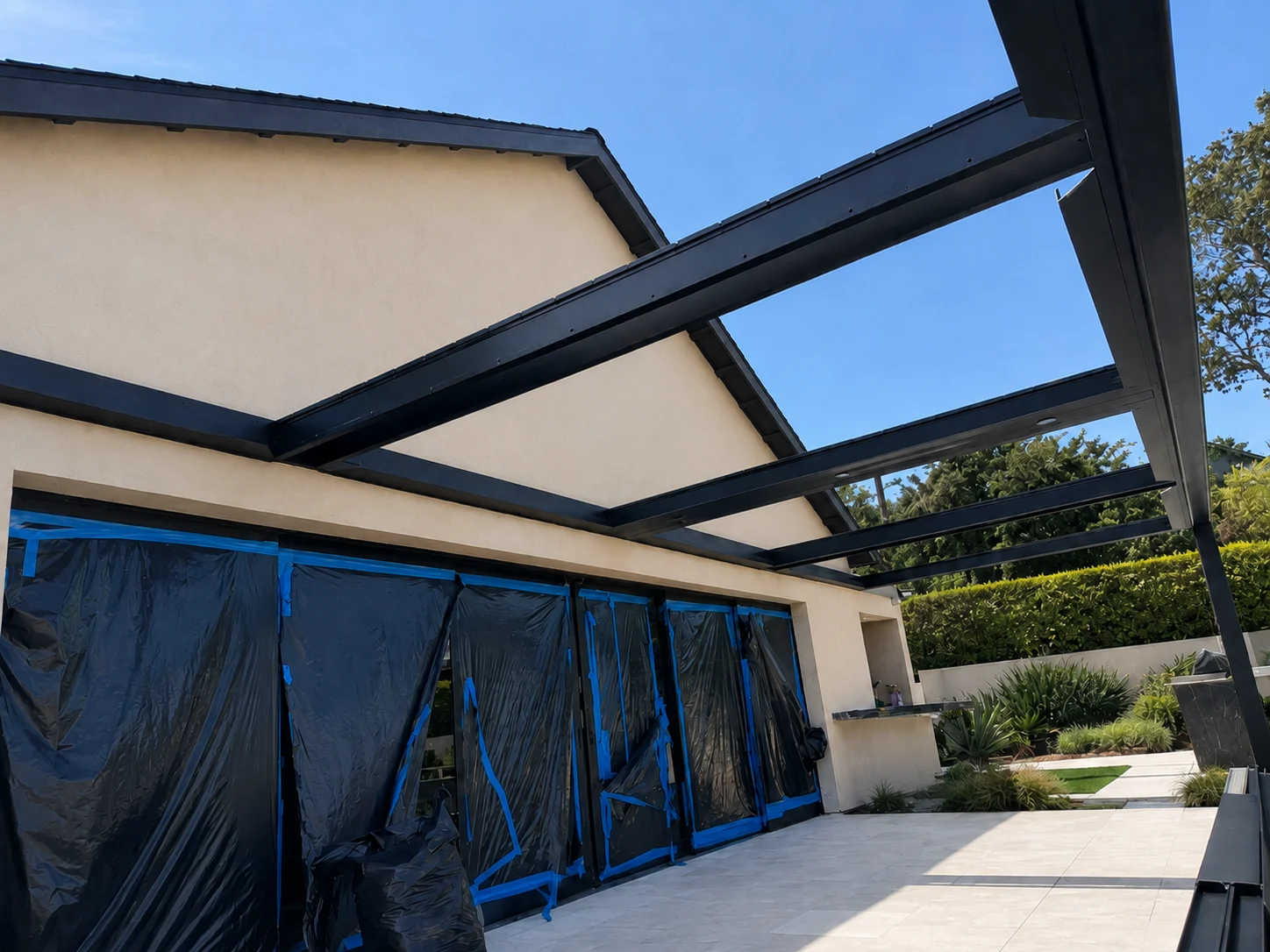 Patio Area Show house wall, slab, roofline, gutters, windows, and doors.