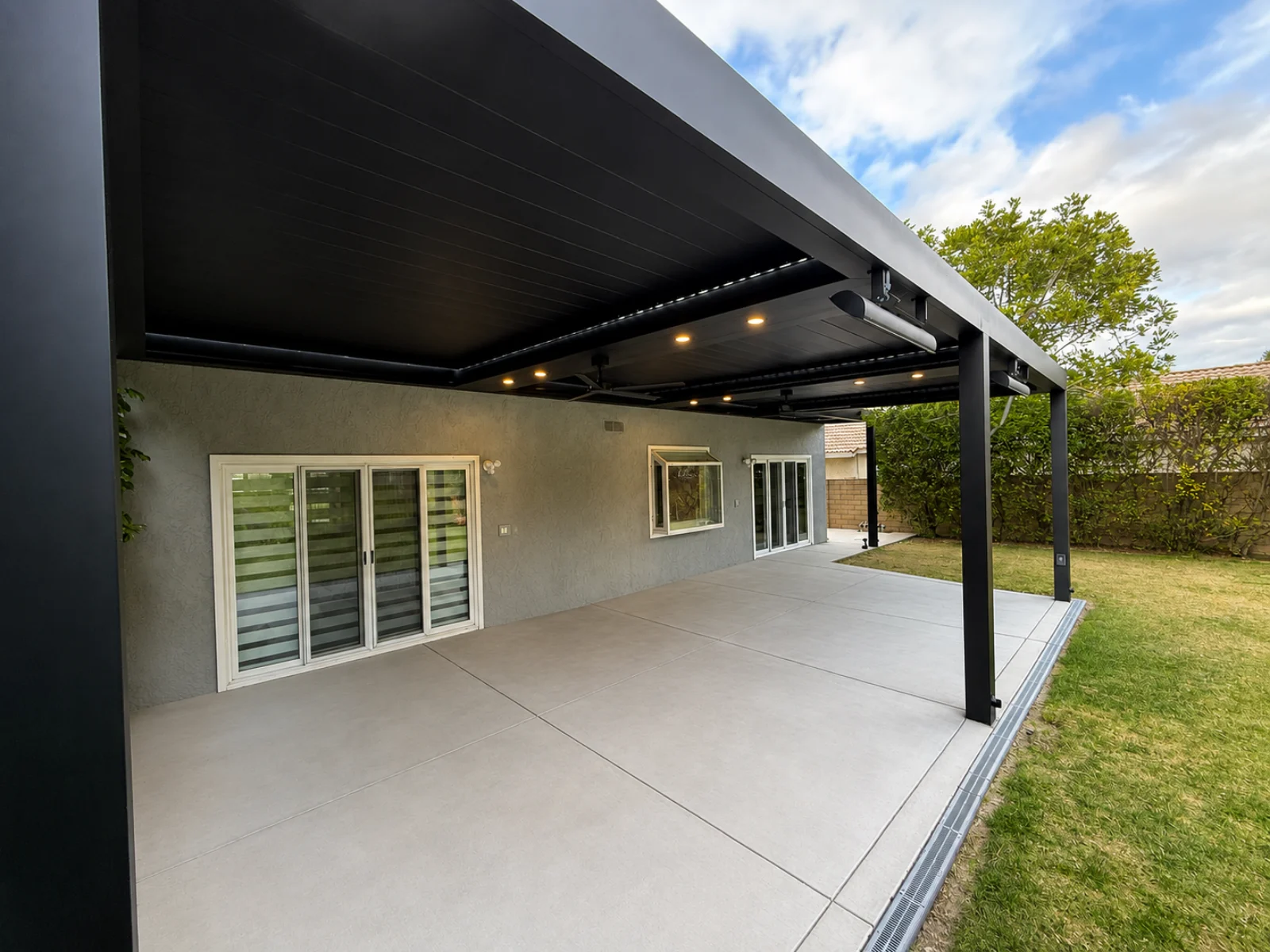 Project view of automatic louver pergola roof integrated with a structural aluminum frame