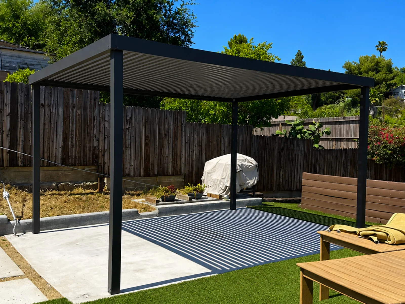 Aluminum pergola with evenly spaced fixed roof slats